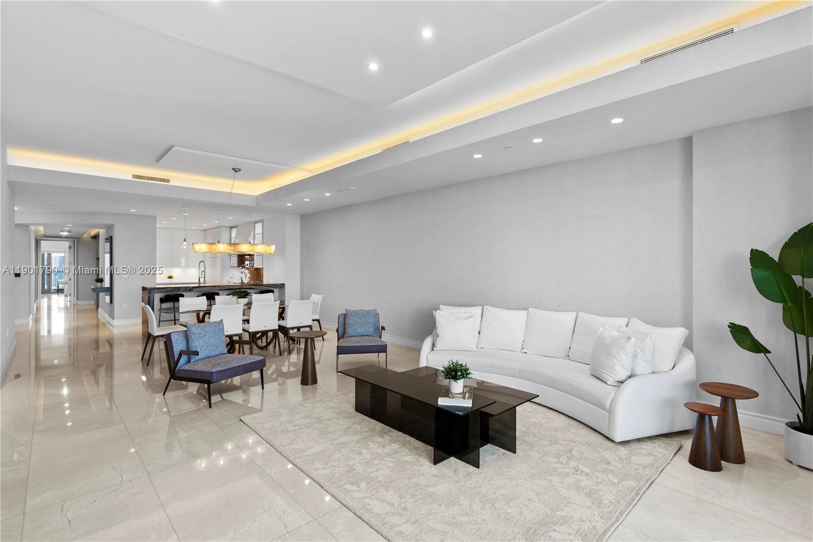 17901 Collins Avenue, Unit 1803 Sunny Isles Beach, FL 33160 - Photo 3 of 57 a living room with furniture and a couch