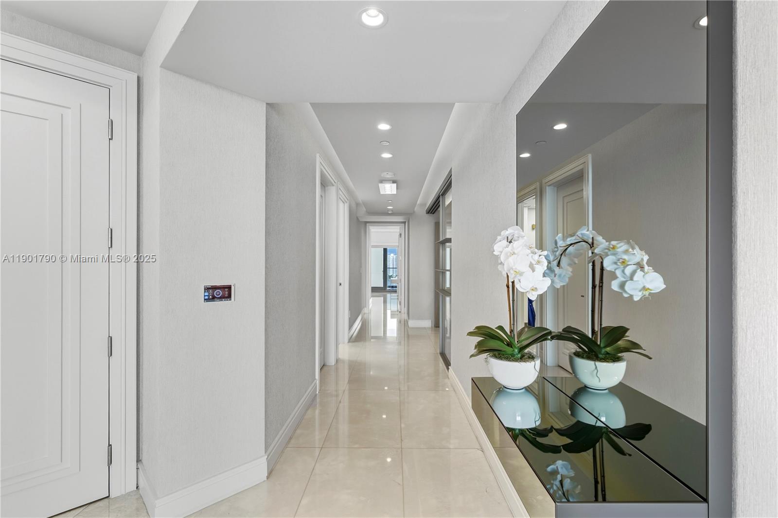 17901 Collins Avenue, Unit 1803 Sunny Isles Beach, FL 33160 - Photo 10 of 57 a view of a hallway with wooden floor