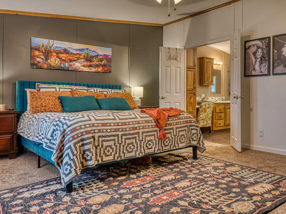 6341 Farm Private Road Levelland, TX 79336 - Photo 16 of 46 a bedroom with a bed and wall painting