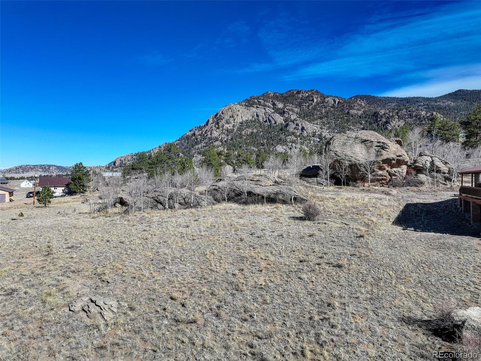 151 Tiara Road Lake George, CO 80827 - Photo 6 of 13 a view of a dry yard with wooden fence
