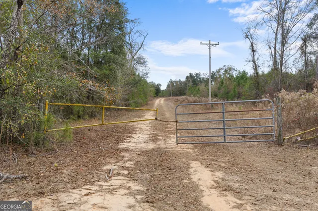 a view of outdoor space with wooden fence