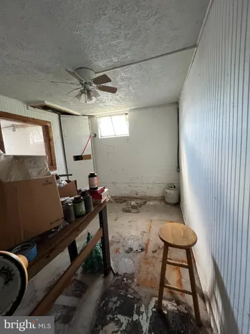 a view of a patio with table and chairs and potted plants