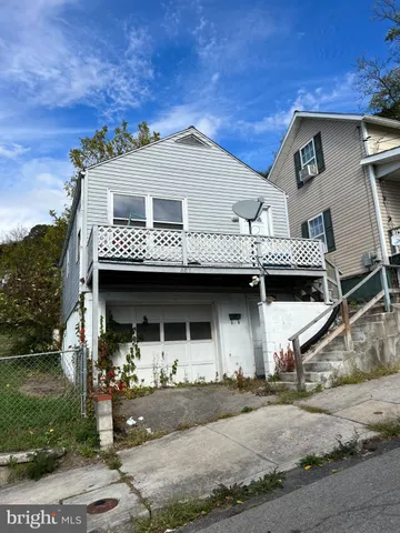 a front view of a house with yard