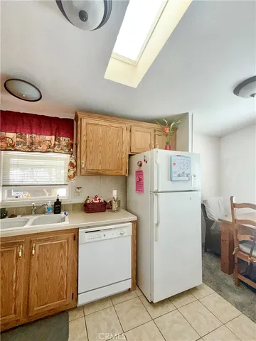 a utility room with cabinets dryer and washer