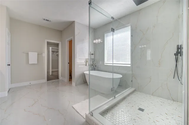 a bathroom with a bathtub and toilet