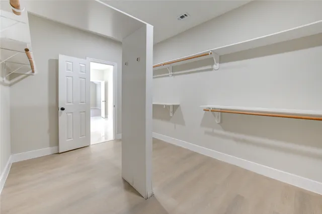 a view of an empty walk in closet