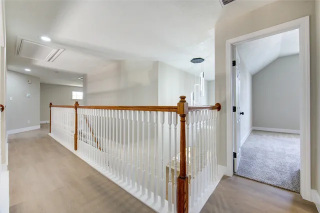 a view of a hallway with a window