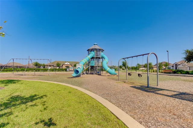 a view of a swimming pool with an outdoor seating
