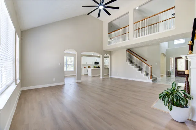 a view of an entryway with wooden floor and a chandelier