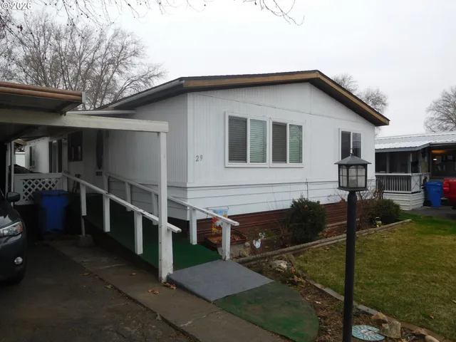 a view of house with yard