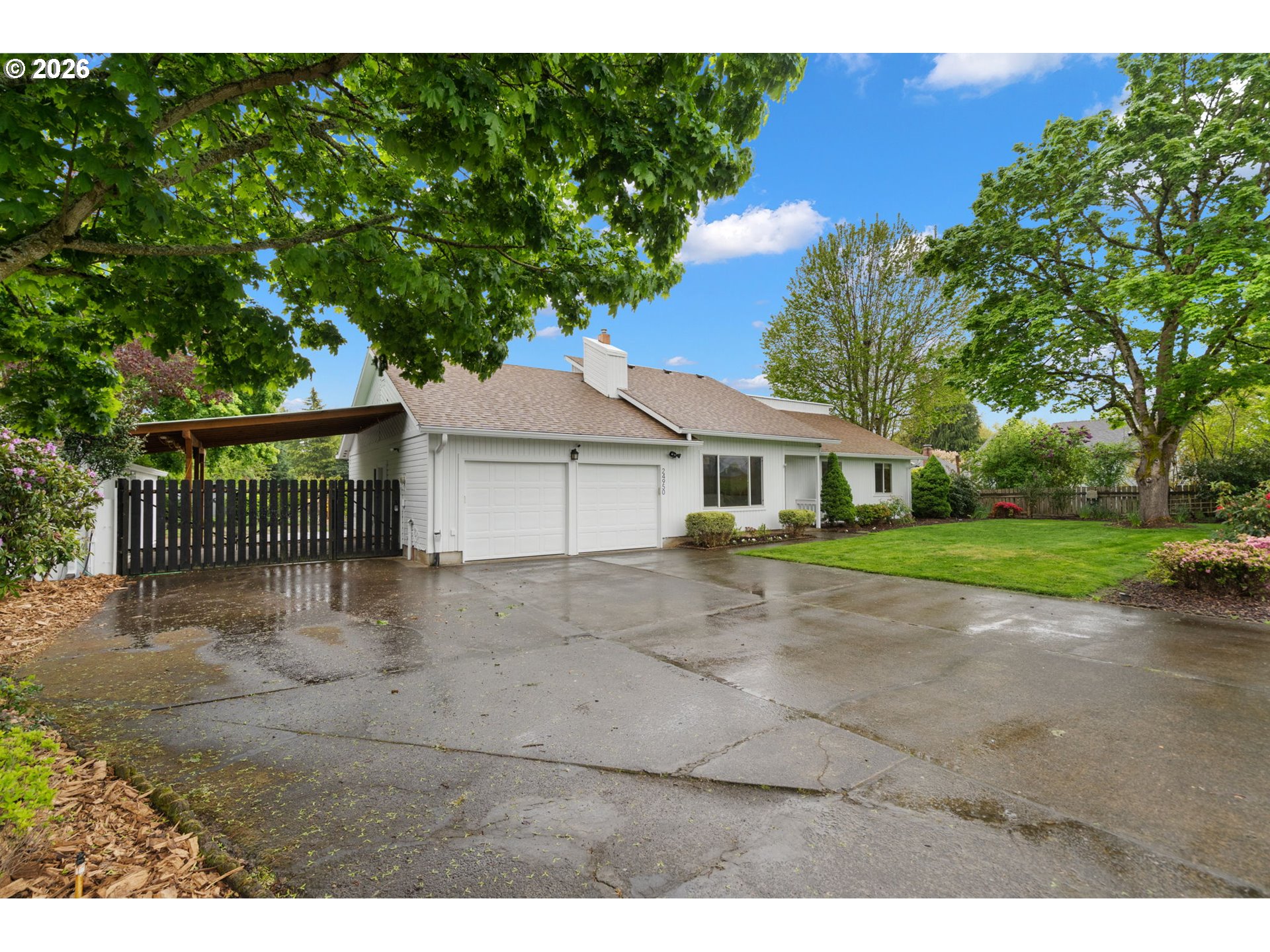 24950 Airport Road Northeast Aurora, OR 97002 - Photo 2 of 44 a front view of a house with a yard and garage