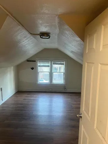 a view of a livingroom with wooden floor