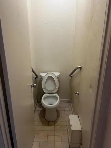 a bathroom with a toilet and a sink