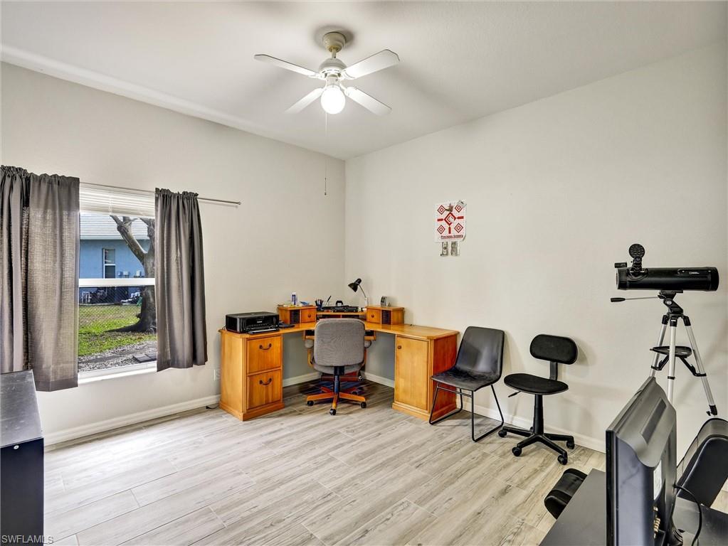 2941 Inlet Cove Lane East Naples, FL 34120 - Photo 13 of 50 a living room with furniture and wooden floor