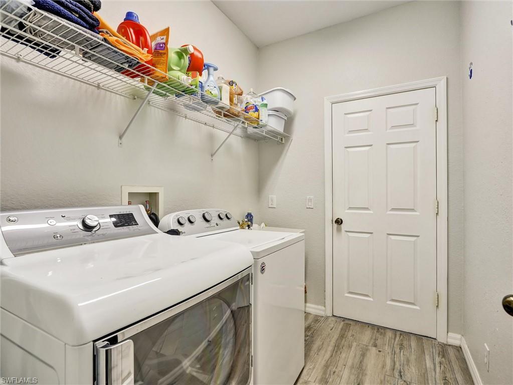 2941 Inlet Cove Lane East Naples, FL 34120 - Photo 19 of 50 a utility room with dryer and washer
