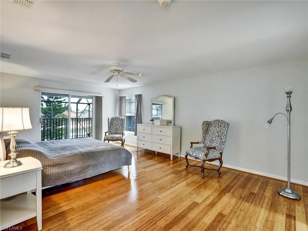 2941 Inlet Cove Lane East Naples, FL 34120 - Photo 20 of 50 a living room with furniture and a wooden floor