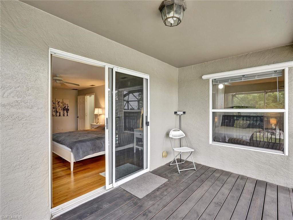2941 Inlet Cove Lane East Naples, FL 34120 - Photo 25 of 50 a living room with a furniture and a window