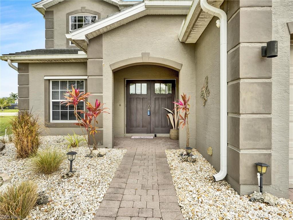 2941 Inlet Cove Lane East Naples, FL 34120 - Photo 3 of 50 a front view of a house