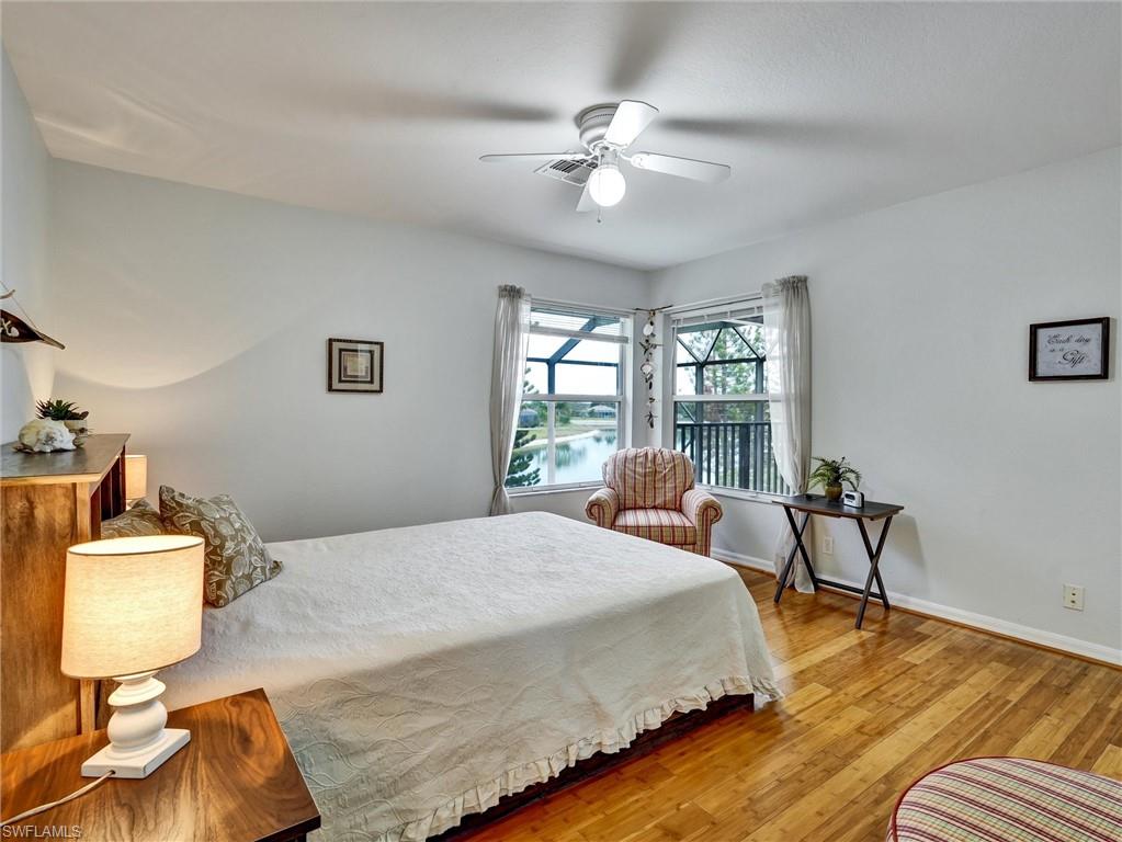 2941 Inlet Cove Lane East Naples, FL 34120 - Photo 31 of 50 a bedroom with a bed and window