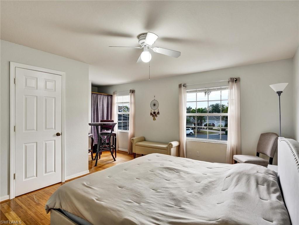 2941 Inlet Cove Lane East Naples, FL 34120 - Photo 38 of 50 a bedroom with a bed and a window