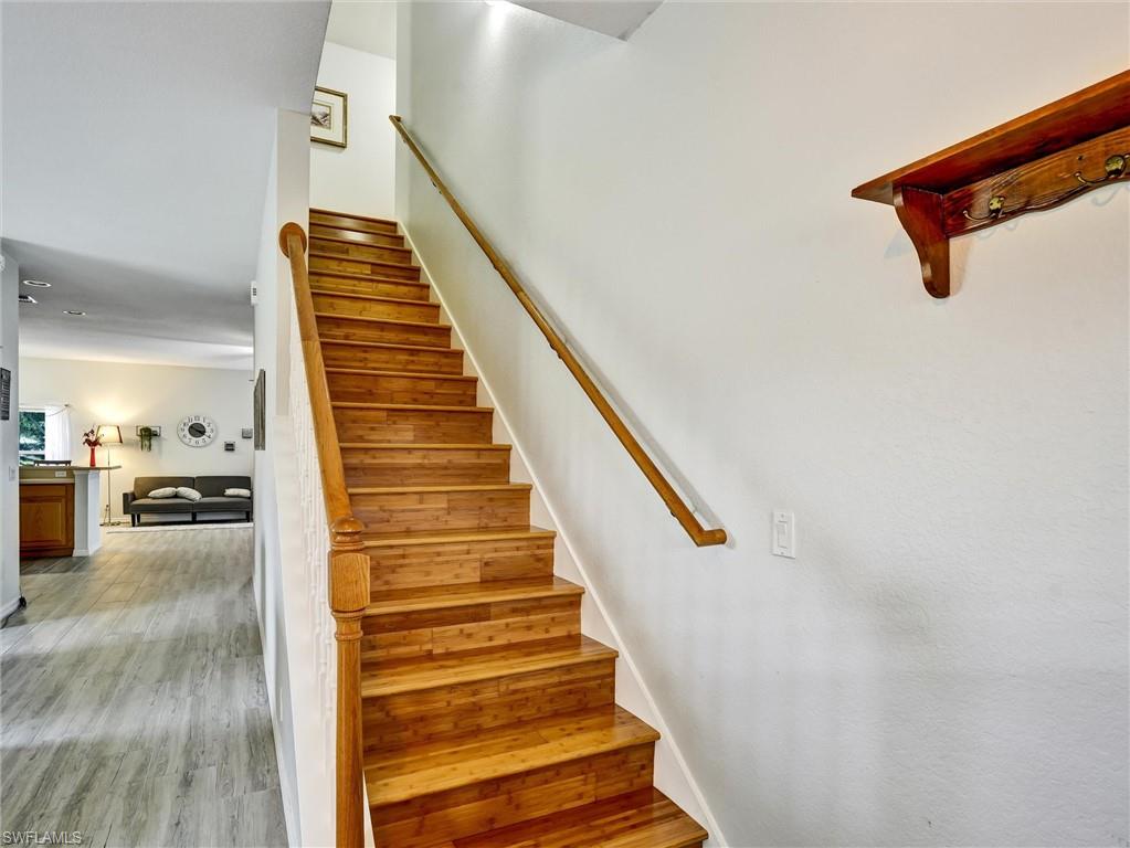 2941 Inlet Cove Lane East Naples, FL 34120 - Photo 44 of 50 a view of entryway and hall with wooden floor