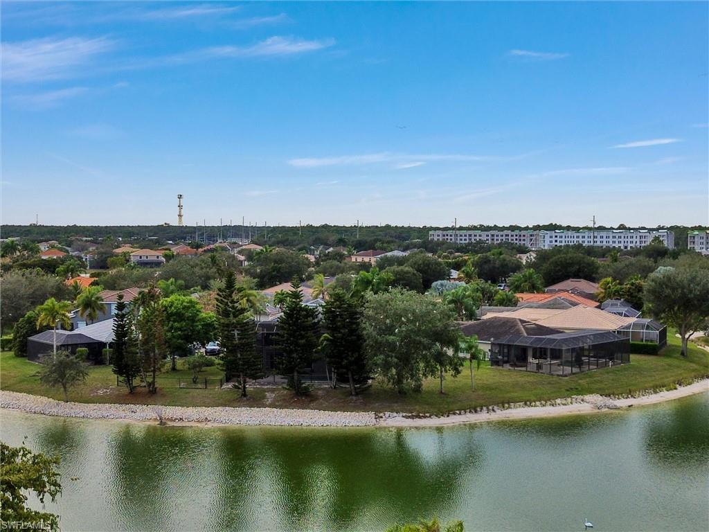 2941 Inlet Cove Lane East Naples, FL 34120 - Photo 50 of 50 an aerial view of a house with a garden and lake view