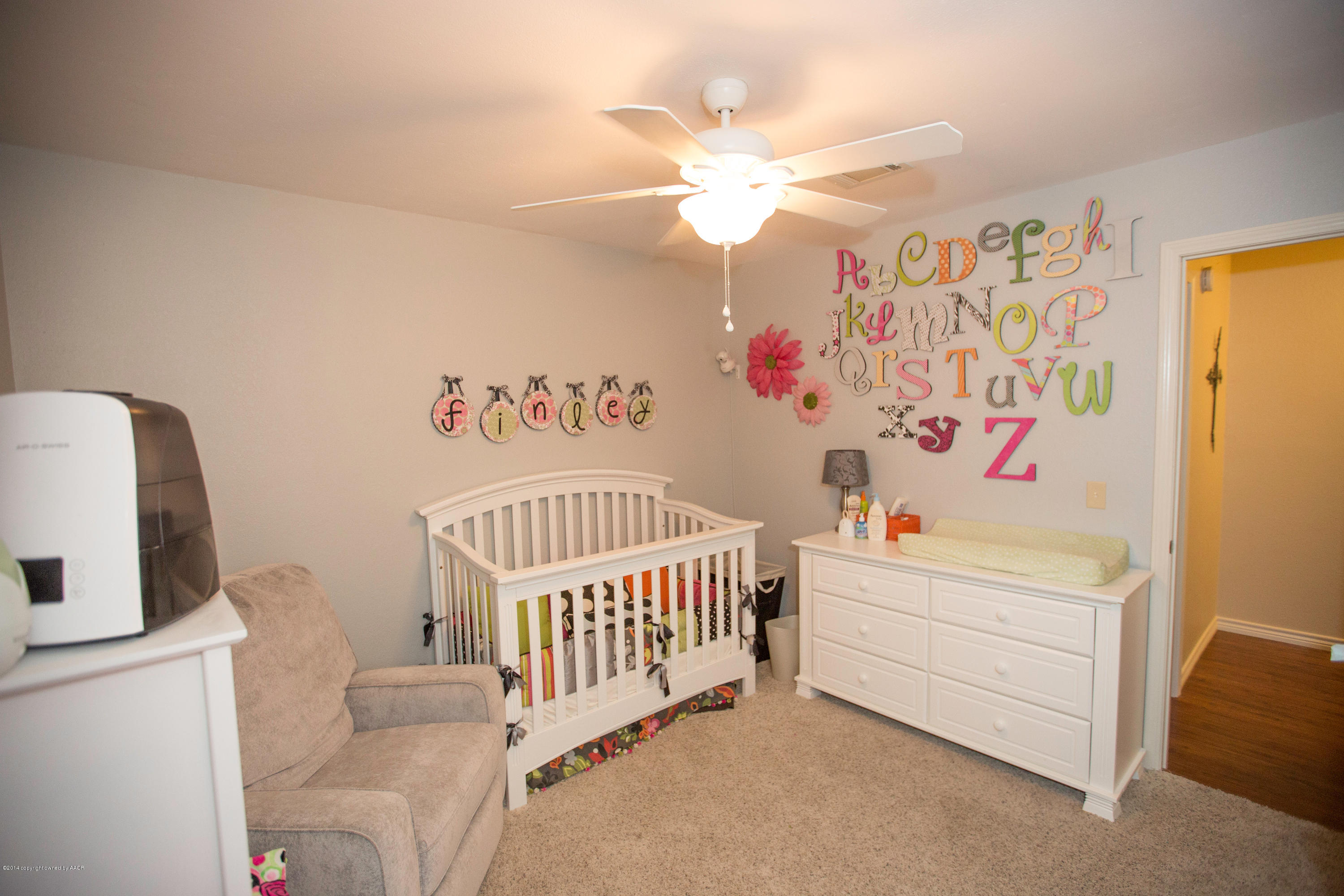 8207 Wrangler Trail Amarillo, TX 79110 - Photo 29 of 51 a bedroom with a bed and a window