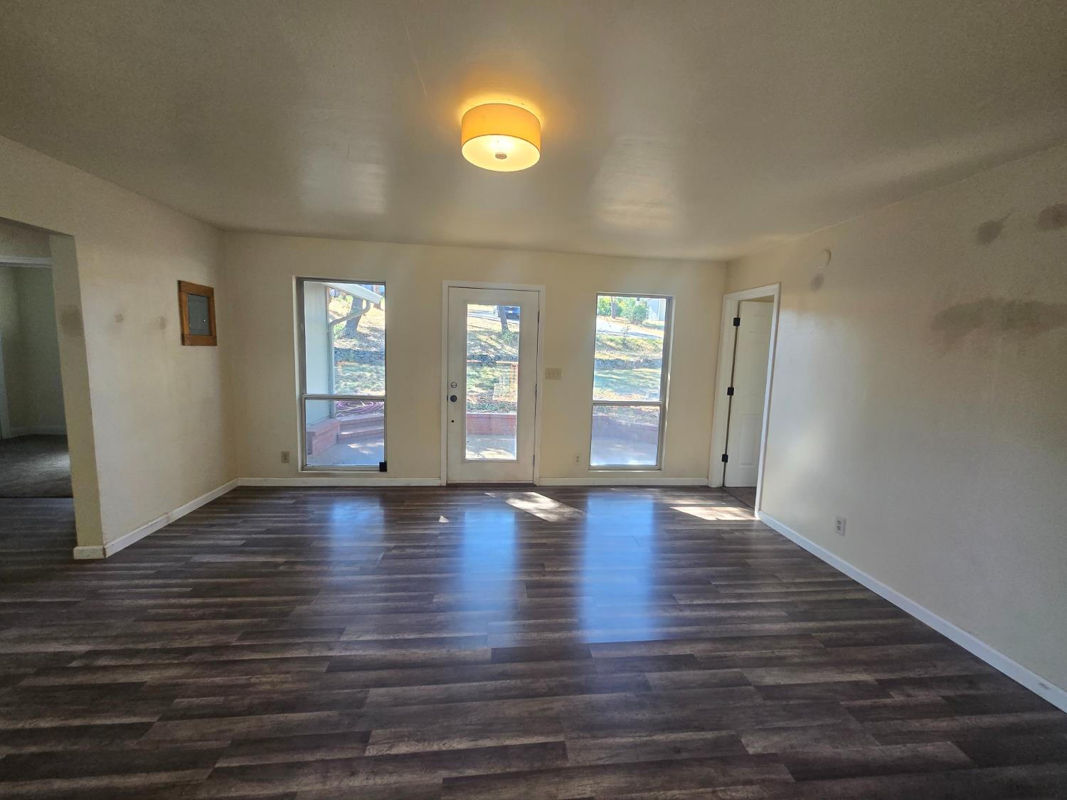 10601 Lime Kiln Road Grass Valley, CA 95949 - Photo 12 of 79 Living room facing the entry door. Natural lighting is in abundance.