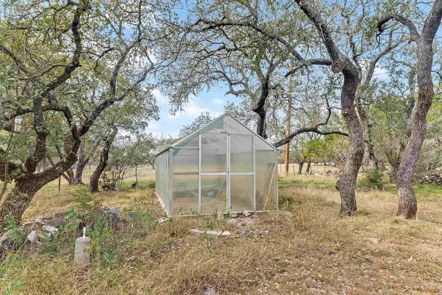 a backyard of a house with lots of green space