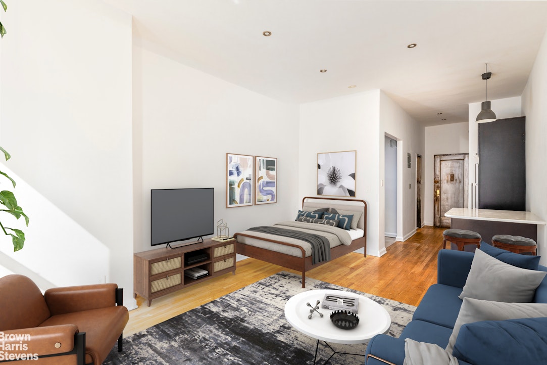 435 East 85th Street, Unit 4C Manhattan, NY 10028 - Photo 3 of 9 a bedroom with furniture and a wooden floor