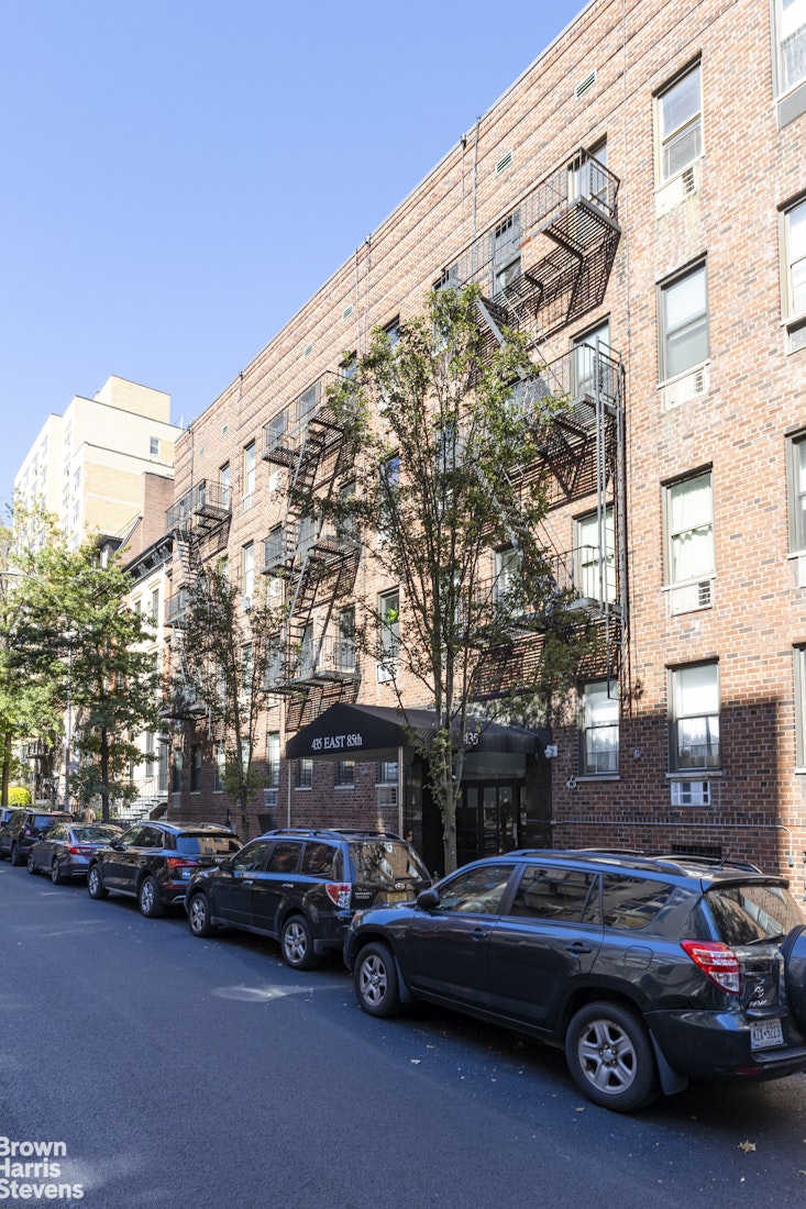435 East 85th Street, Unit 4C Manhattan, NY 10028 - Photo 8 of 9 a view of car parked in front of a building