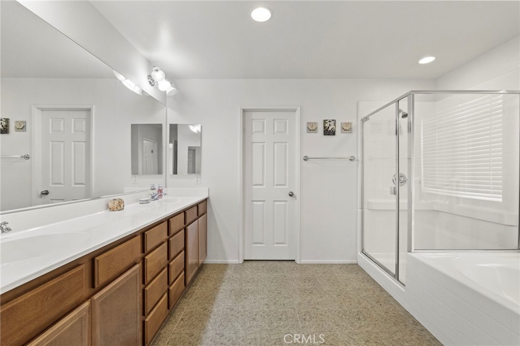 34072 Corktree Road Lake Elsinore, CA 92532 - Photo 30 of 53 Master Suite Bathroom w/ dual vanity, separate shower & soaking tub