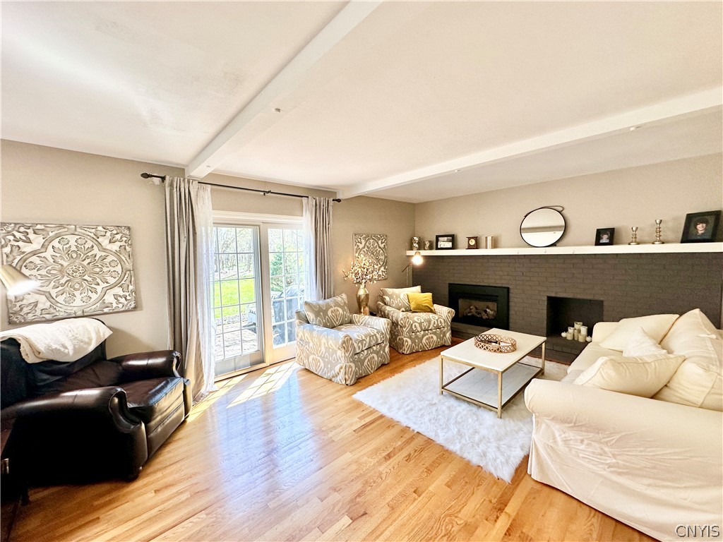 7297 Dabney Lane Manlius, NY 13066 - Photo 10 of 47 Family Room w/Gas Fireplace & Sliding Door to pati