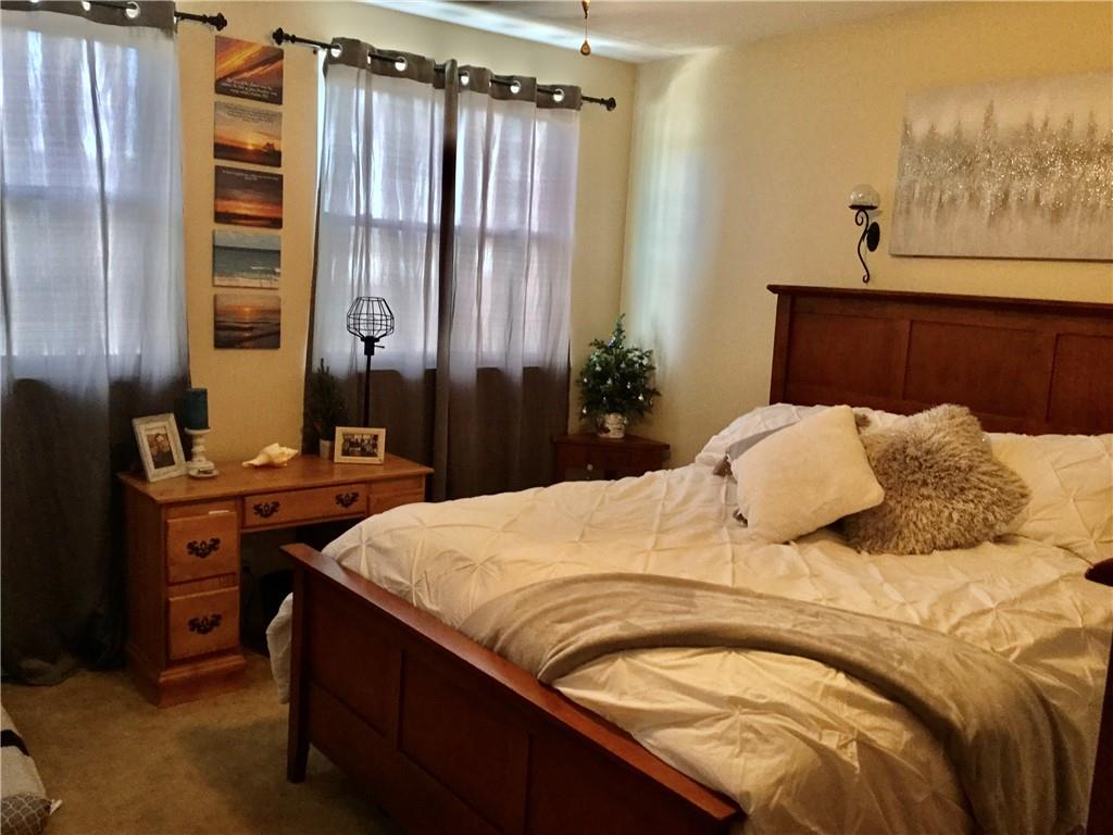 104 Sumner Avenue Vandergrift, PA 15690 - Photo 13 of 26 a bedroom with a bed and a dresser