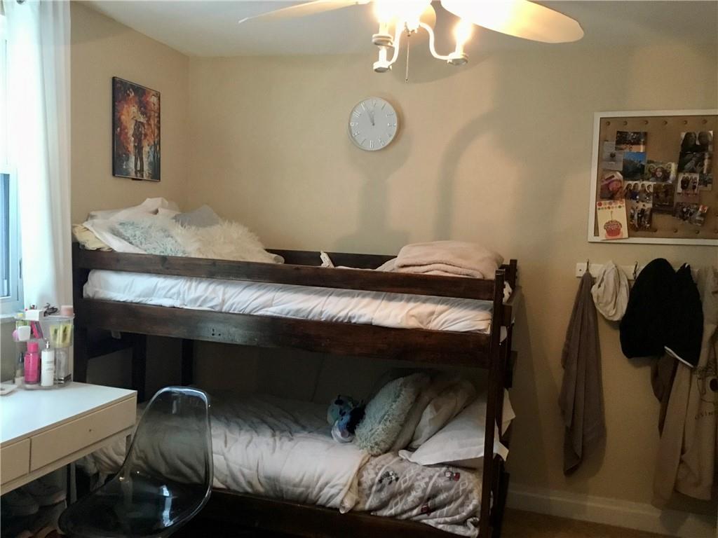 104 Sumner Avenue Vandergrift, PA 15690 - Photo 16 of 26 a bedroom with a bed and a table