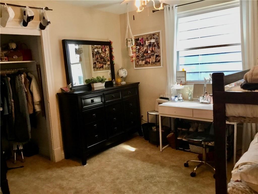 104 Sumner Avenue Vandergrift, PA 15690 - Photo 17 of 26 a room with a desk and a closet