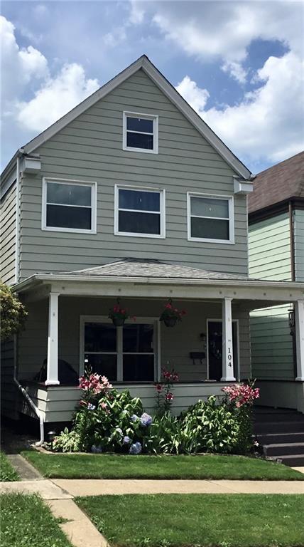 104 Sumner Avenue Vandergrift, PA 15690 - Photo 2 of 26 a view of a house with garden and plants