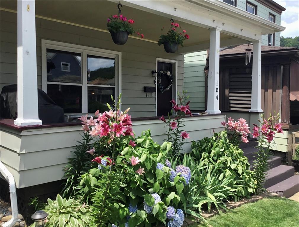 104 Sumner Avenue Vandergrift, PA 15690 - Photo 3 of 26 a front view of a house with flowers