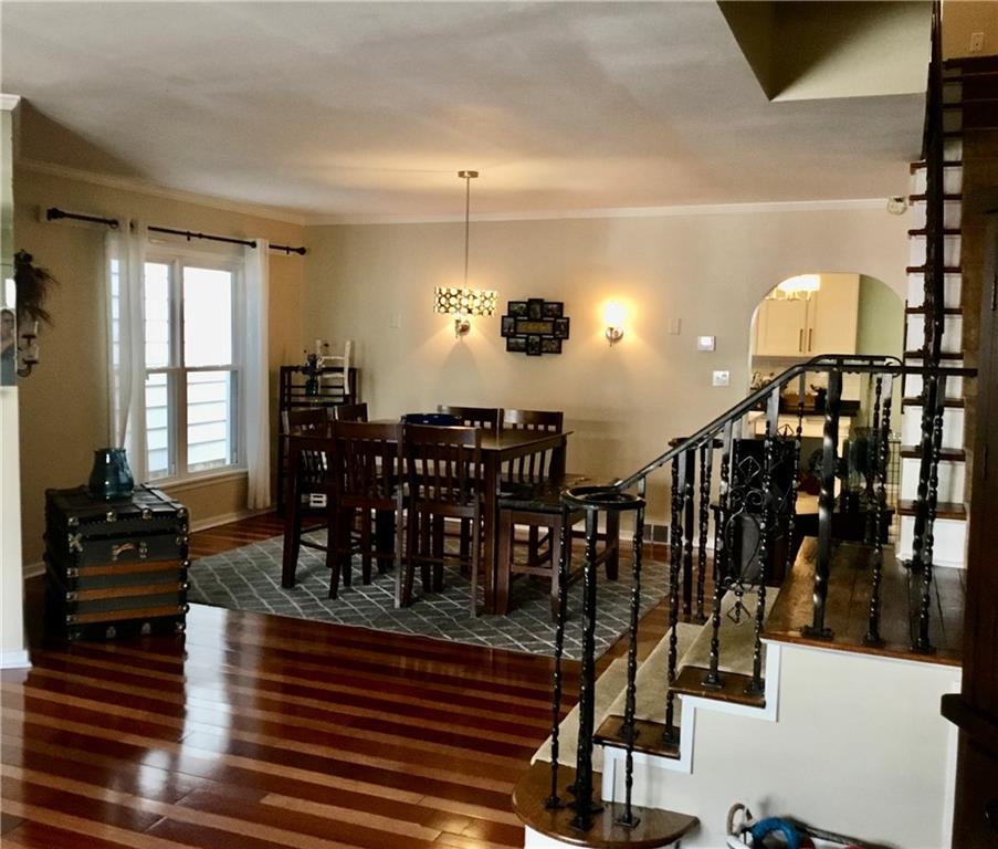 104 Sumner Avenue Vandergrift, PA 15690 - Photo 7 of 26 a dining room with lots of wooden furniture and windows