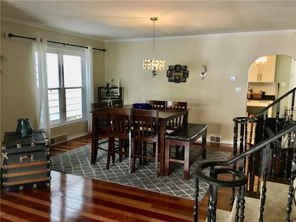104 Sumner Avenue Vandergrift, PA 15690 - Photo 8 of 26 a view of a dining room with furniture window and wooden floor
