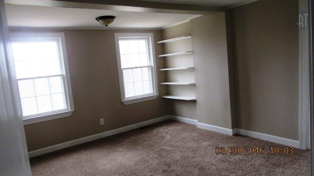 3490 Shouse Road Santa Fe, TN 38482 - Photo 9 of 13 MASTER BEDROOM WITH CARPET ON THE FLOOR AND BUILT IN SHELVES
