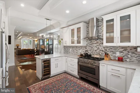a kitchen with stainless steel appliances a refrigerator sink and microwave