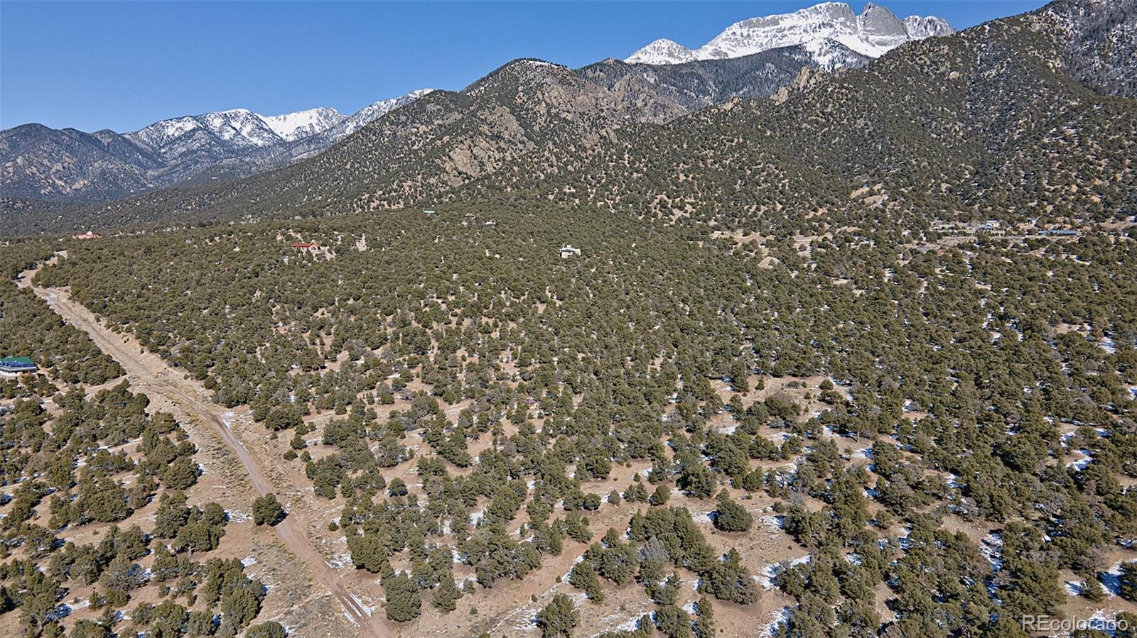 Naropa Tract Crestone, CO 81131 - Photo 3 of 22 a view of a large building with a mountain in the background