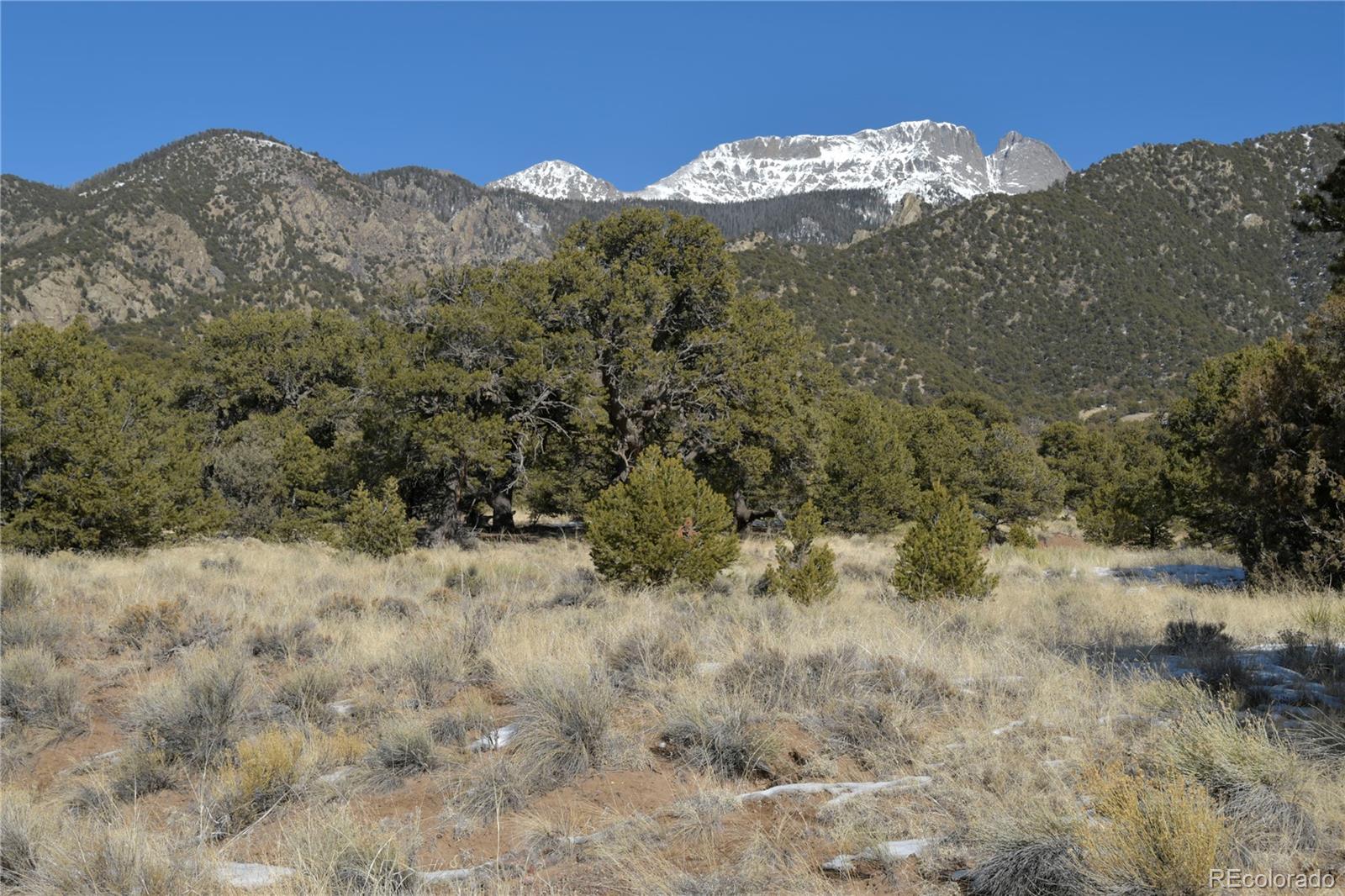 Naropa Tract Crestone, CO 81131 - Photo 6 of 22 a view of a dry yard with mountains in the background