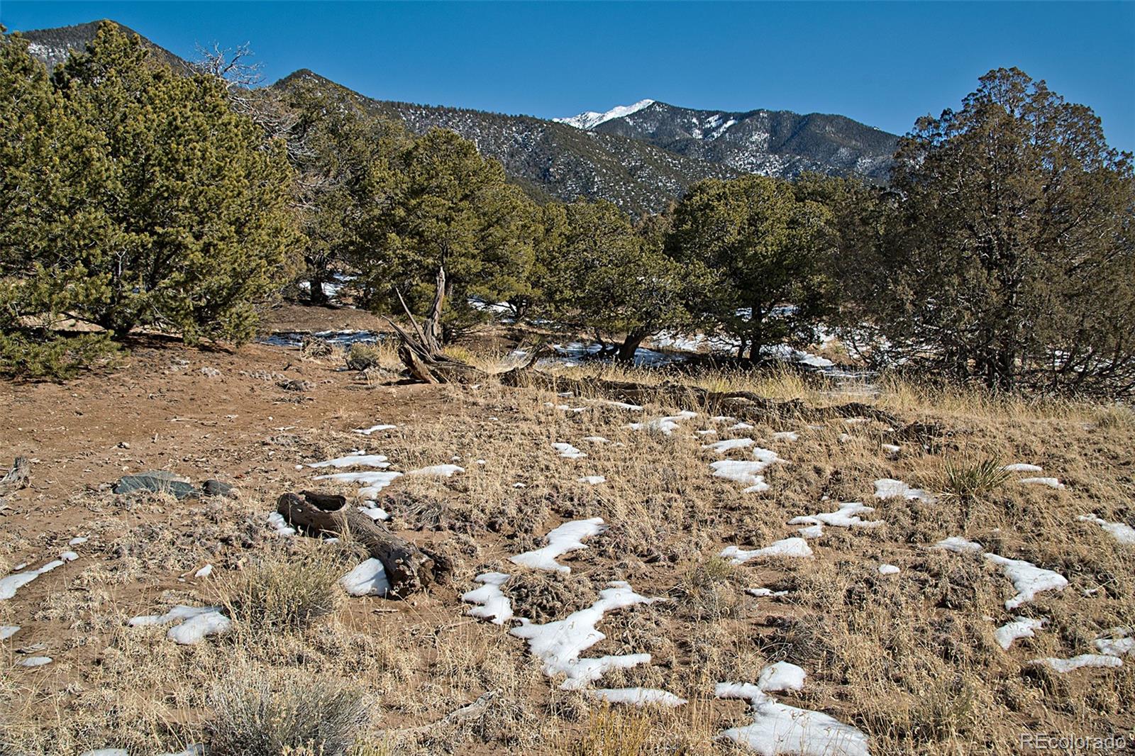 Naropa Tract Crestone, CO 81131 - Photo 8 of 22 a view of mountains in middle of the green field
