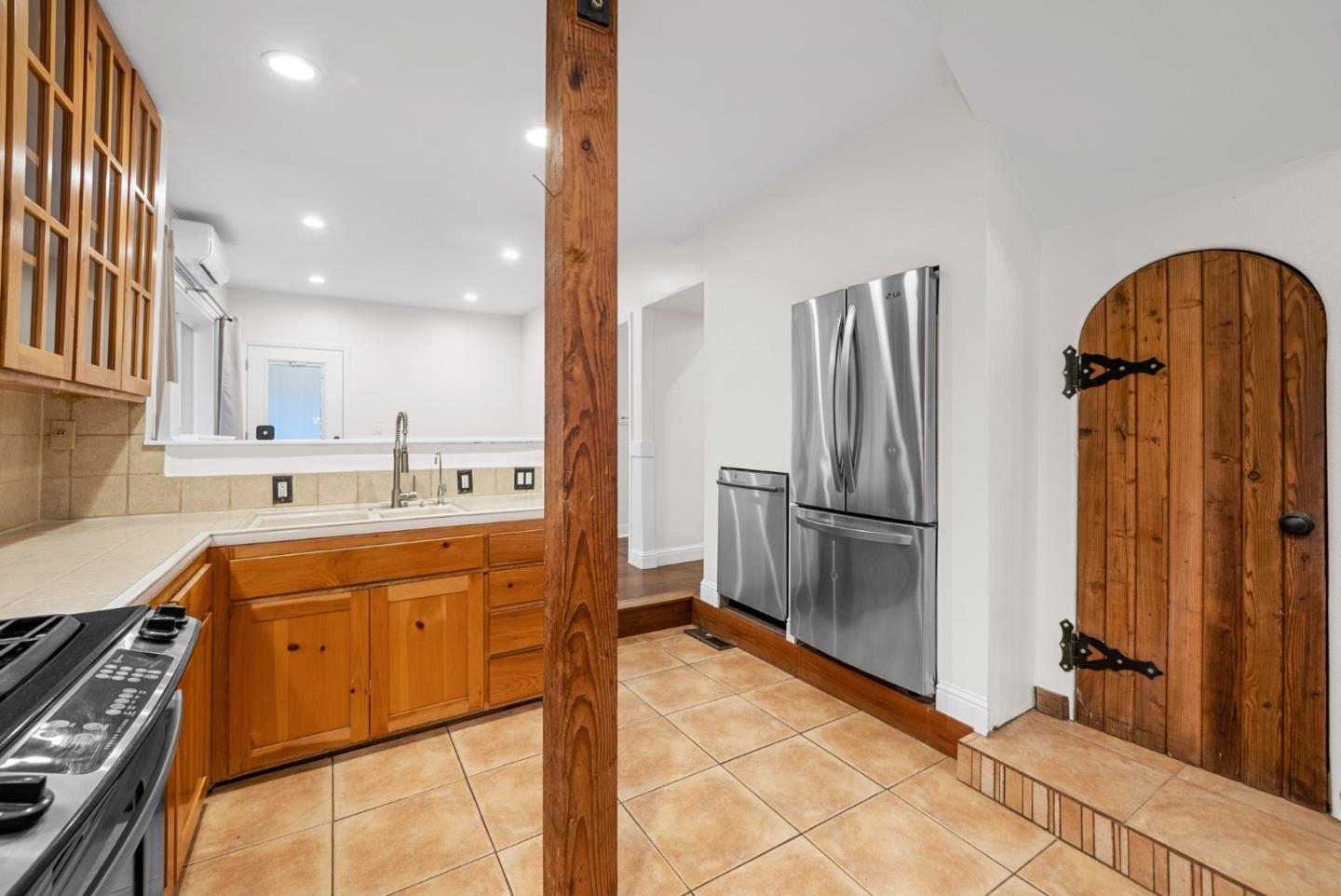 975 Logan Creek Road Boulder Creek, CA 95006 - Photo 24 of 41 a kitchen with stainless steel appliances granite countertop a refrigerator a stove and a sink