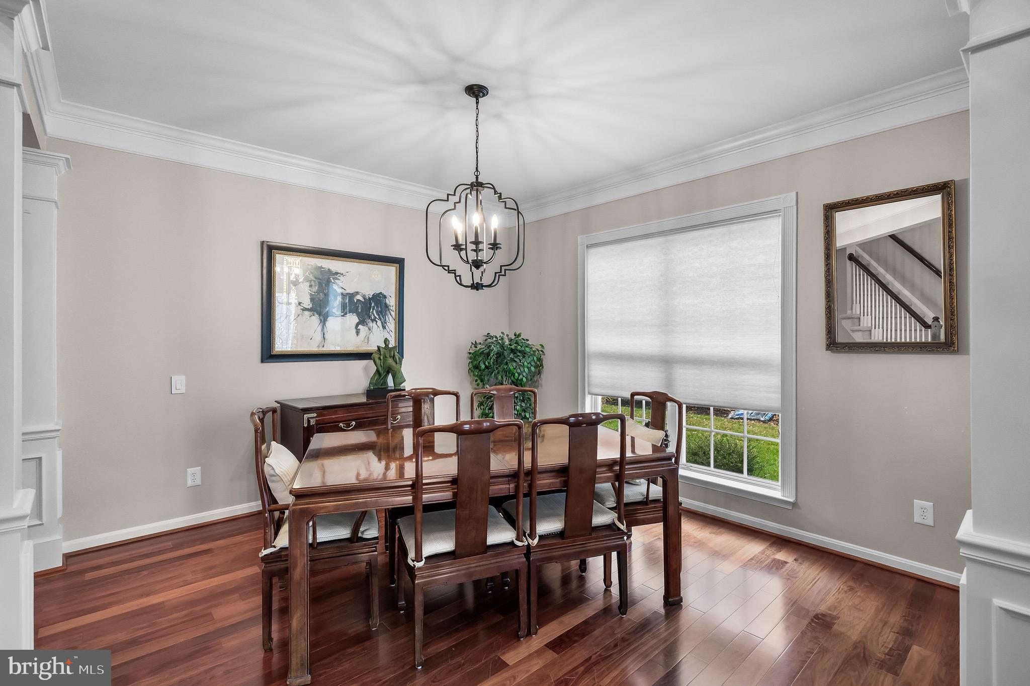 77 Pennington Court Delanco, NJ 08075 - Photo 11 of 46 a view of a dining room with furniture window and wooden floor