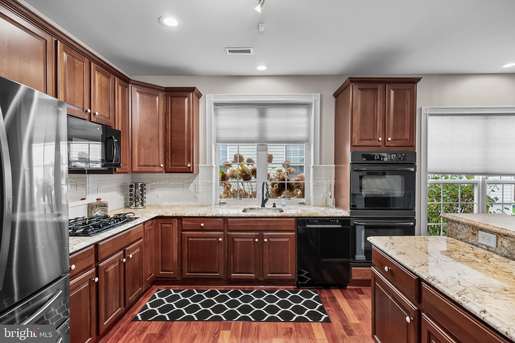 77 Pennington Court Delanco, NJ 08075 - Photo 12 of 46 a kitchen with a sink stove and refrigerator