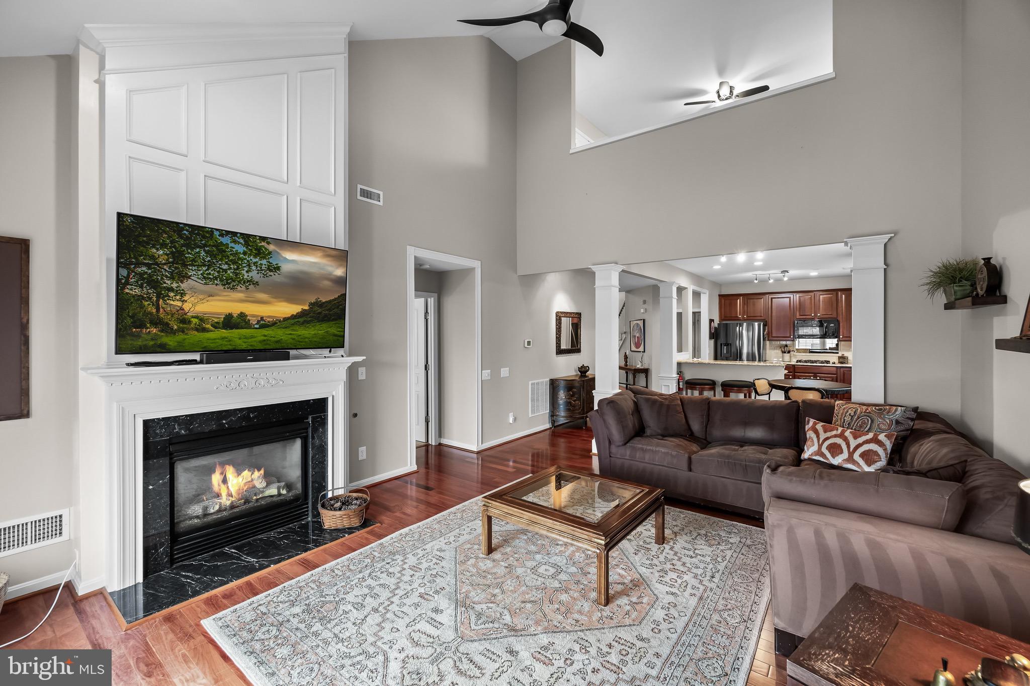 77 Pennington Court Delanco, NJ 08075 - Photo 17 of 46 a living room with furniture a fireplace and a flat screen tv