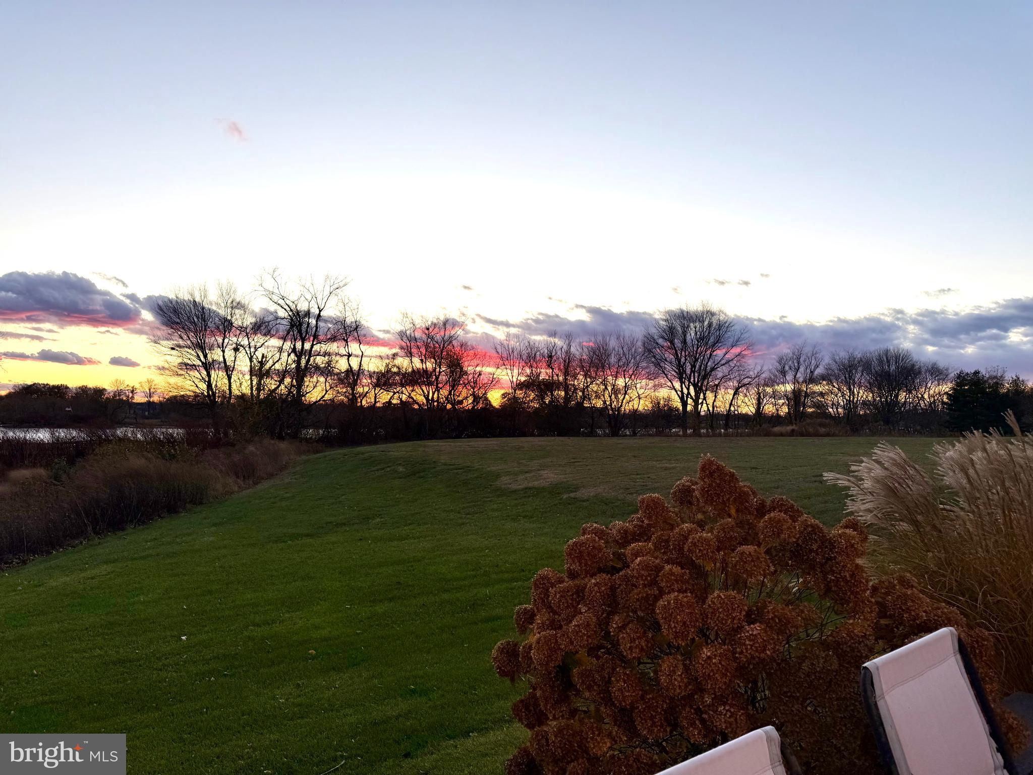77 Pennington Court Delanco, NJ 08075 - Photo 2 of 46 a view of a lake with houses in the back